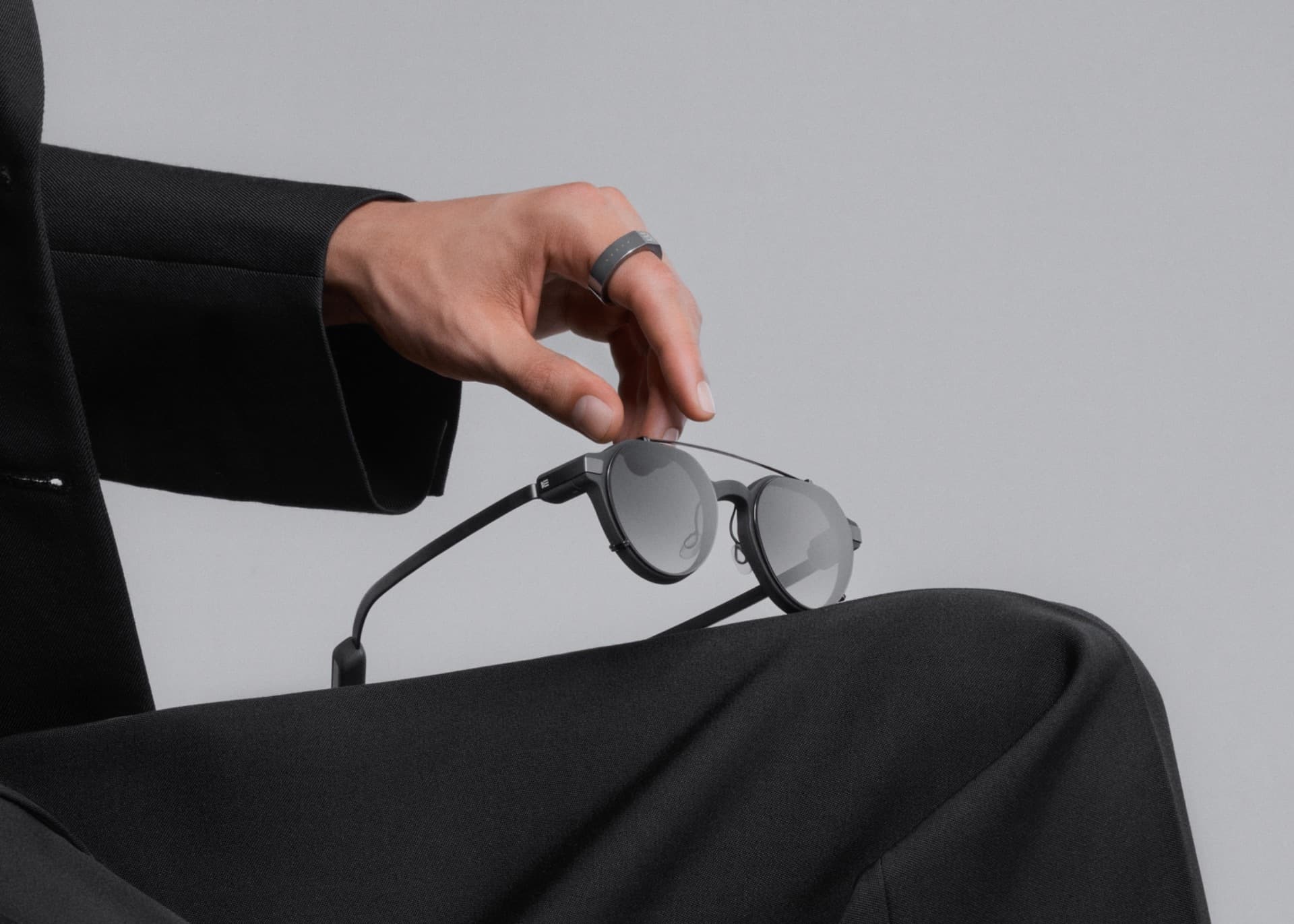 A person holding Even Realities smart glasses