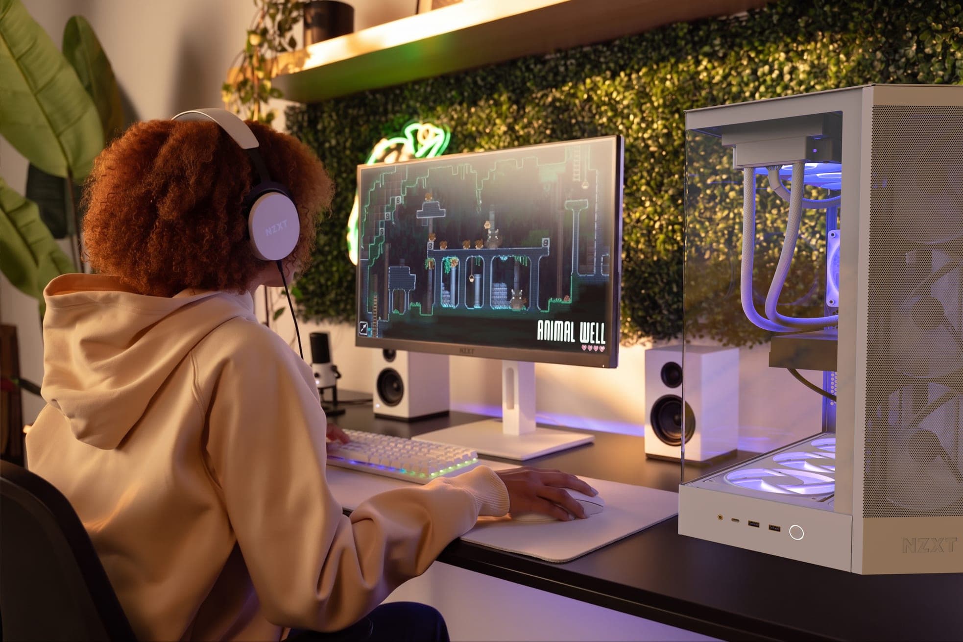 A person gaming on an NZXT desktop computer
