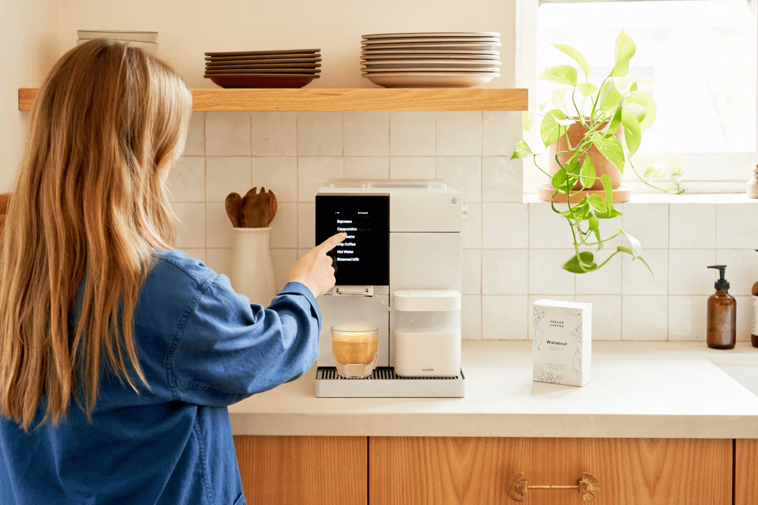 A person making coffee with a Terra Kaffe machine